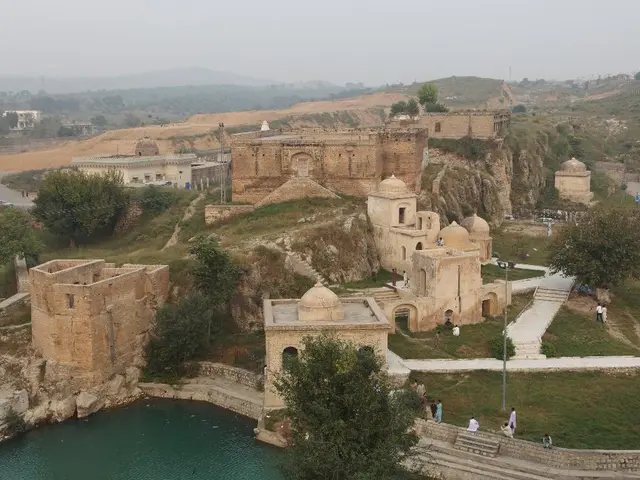 High-elevation medieval village nestled amidst Lozère River, France, offers breathtaking views from...