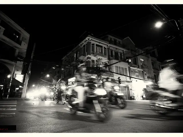 It is the black and white image in which we can see there are so many vehicles on the road. In the...