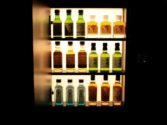 In this image we can see a wine bottles in the rack.